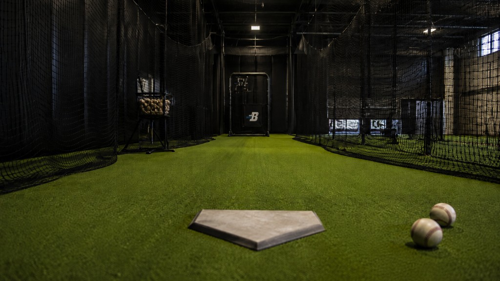Boost Baseball Bellevue facility — wide view of indoor batting cages and training lanes.