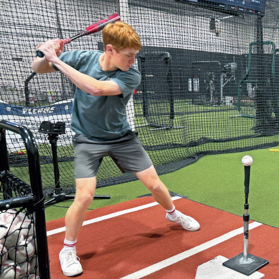 Boost Baseball cage training session on the Bellevue training floor.