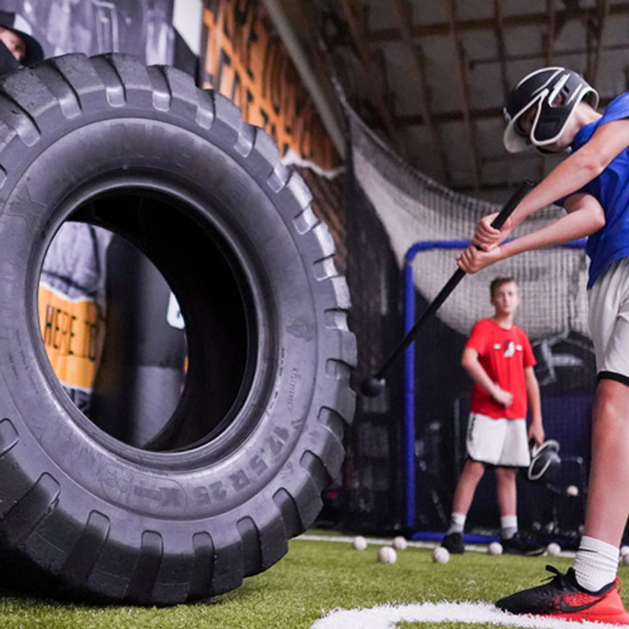 Boost Baseball athlete preparation on the training floor before cage work.